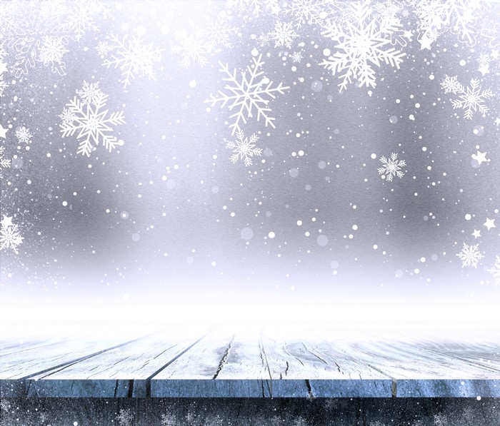 Christmas snowflakes on wooden planks