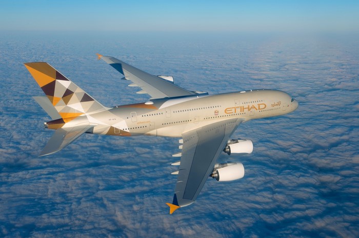 Etihad Airways Airbus A380-800 flying above clouds
