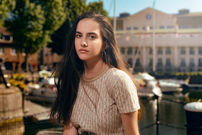 Brown haired girl with hoop earrings