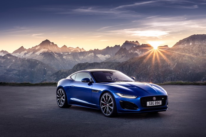 Blue Jaguar F-Type R Coupe in Mountains at Sunset
