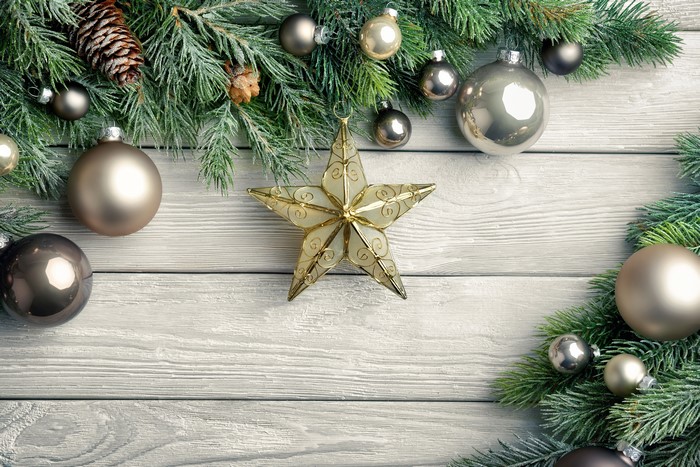 Christmas ornaments and star on wood planks