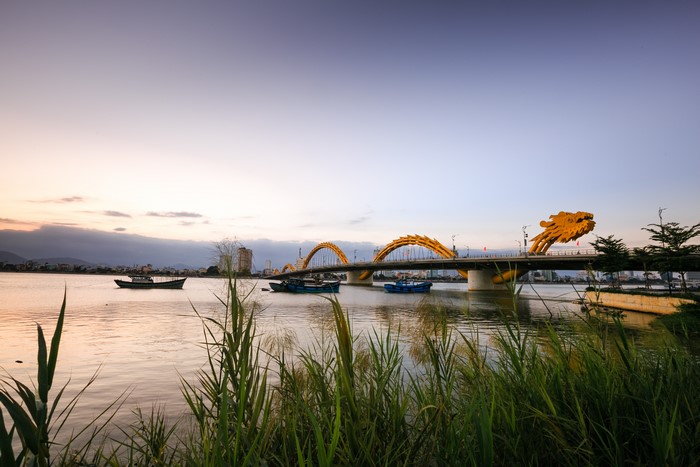 Dragon Bridge and Riverboats in Danang, Vietnam