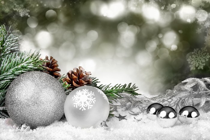 Christmas balls and pine cones on snow