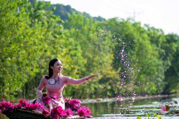 4K Asian Girl in Boat with Water Lilies
