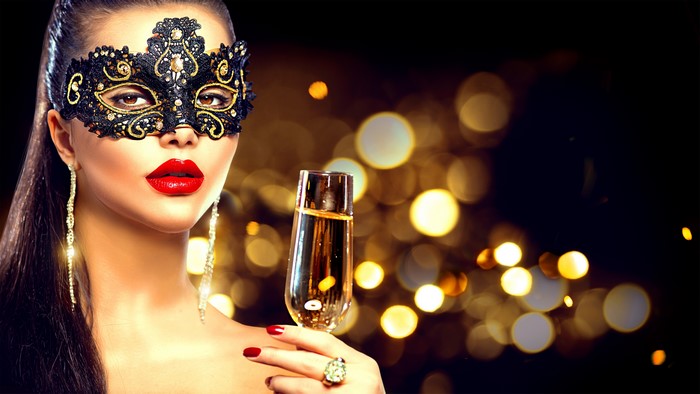 Woman in Masquerade Mask Holding Champagne