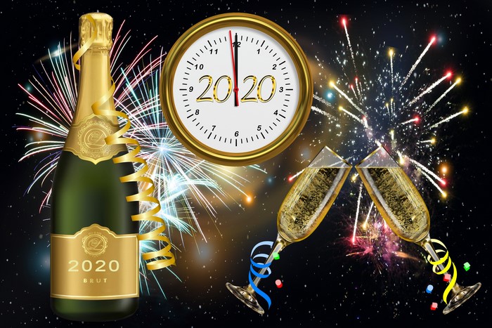 Champagne bottle and glasses with fireworks and 2020 clock
