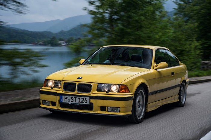 Yellow BMW Coupe in Motion