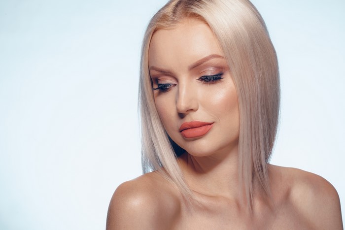 Blonde girl with makeup and hairstyle