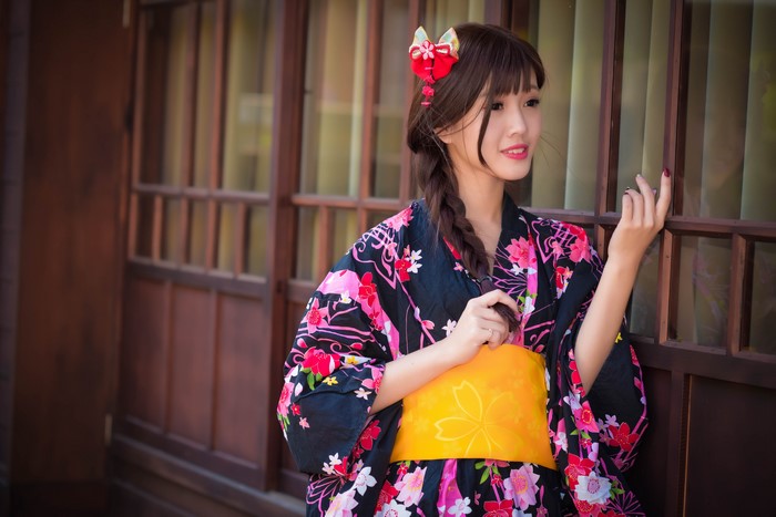 Young Asian woman in kimono with braided hair