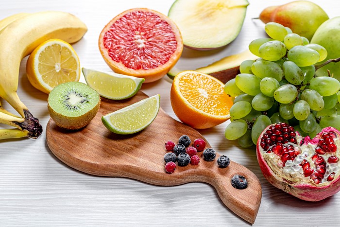 Assortment of fresh fruits on a cutting board