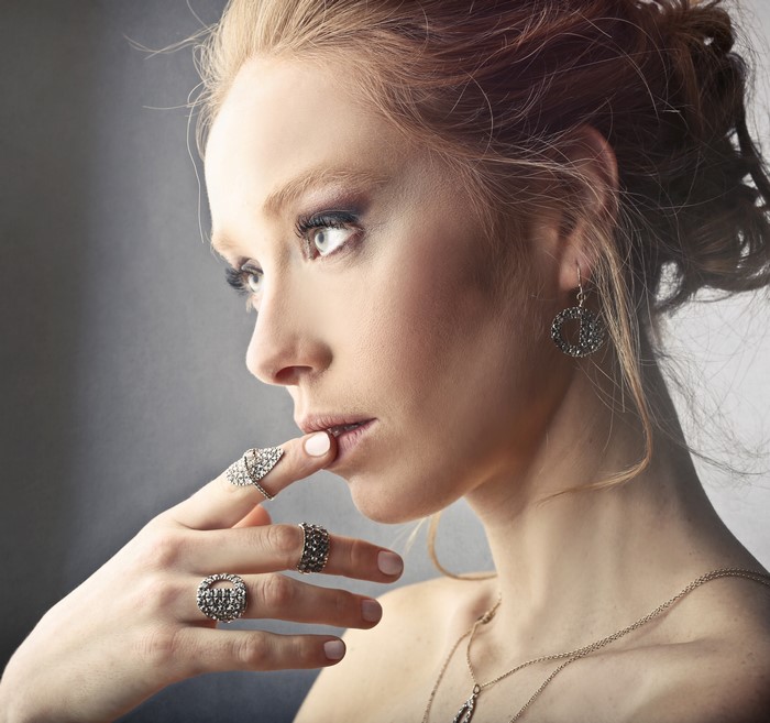 Woman with Rings and Earrings