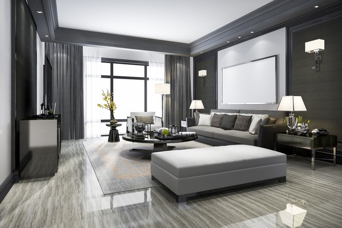 Modern living room with sofa, coffee table, and large window