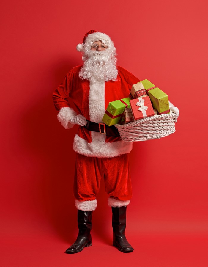 Santa Claus holding a basket of gifts