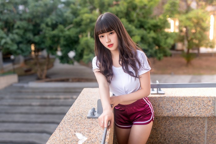 Asian Woman in White T-shirt and Shorts