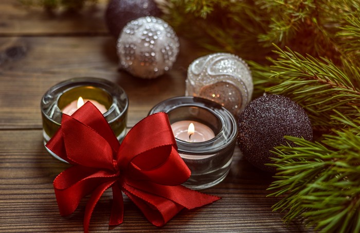 Christmas candles with ornaments and pine branches