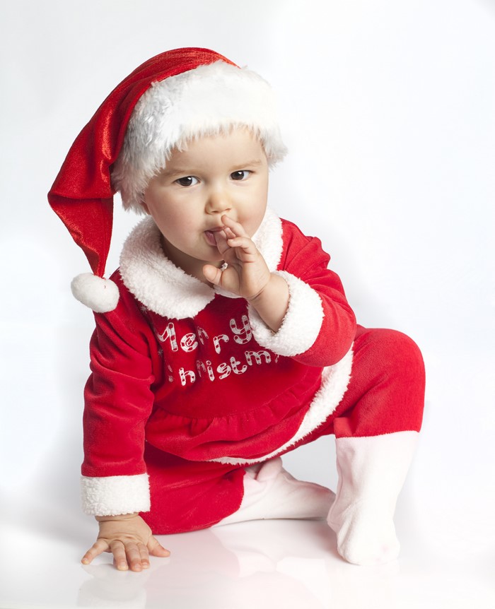 Baby in Santa costume with Christmas hat