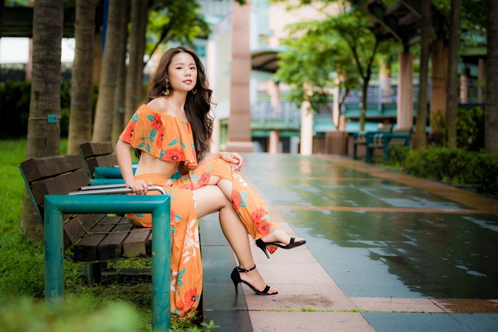 4K Asian Woman Sitting on Bench with Bokeh