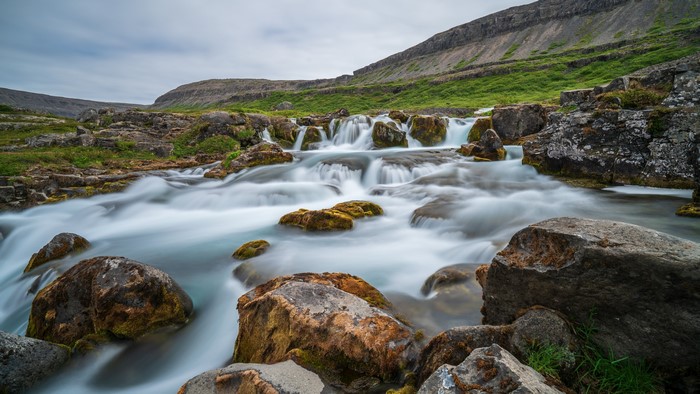 Dynjandi Waterfall in Iceland with Mountains and Stones