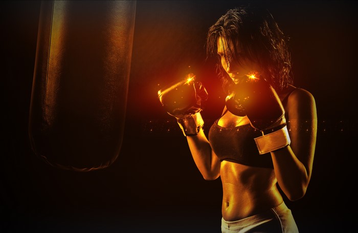 Woman boxing with a punching bag