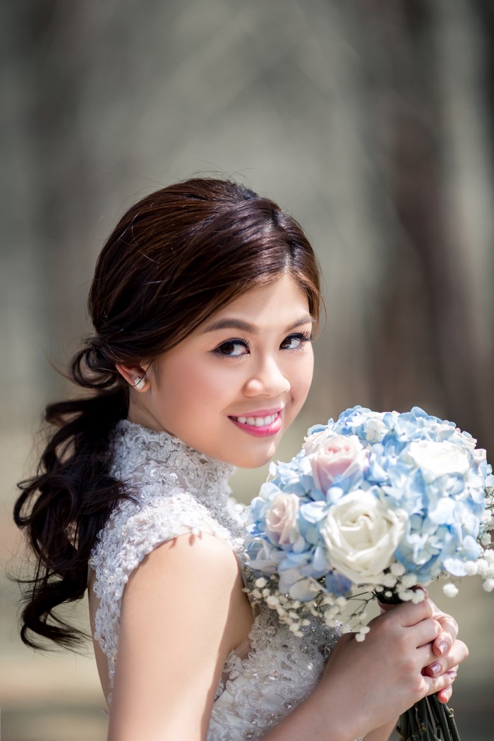 Asian bride with bouquet