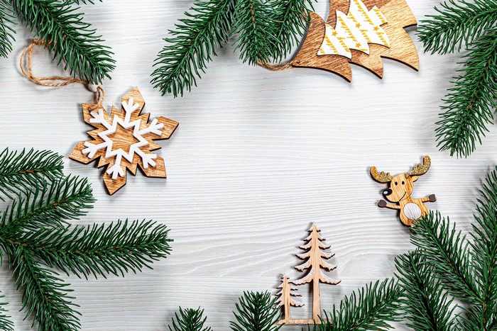 Christmas ornaments with fir branches on a wooden background