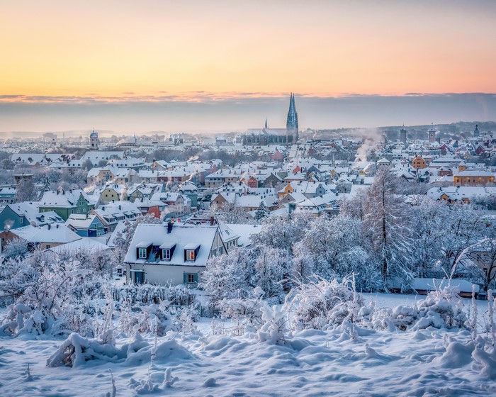 Regensburg, Germany in winter with snow-covered houses