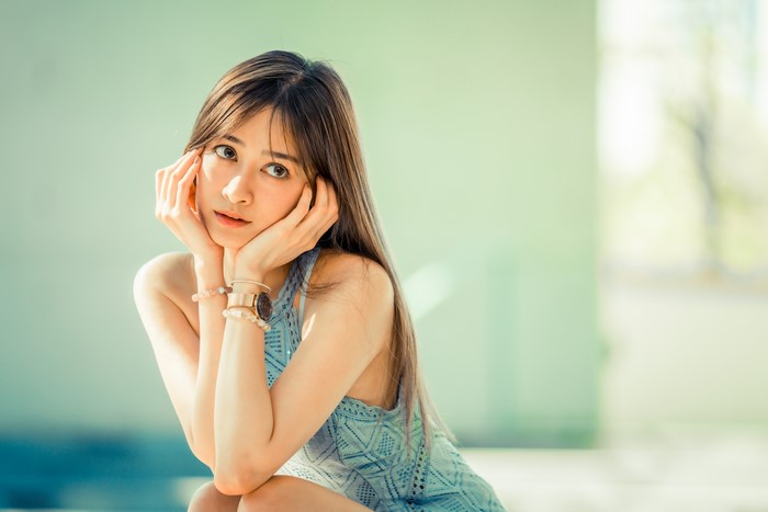 4K Asian Woman in Thoughtful Pose