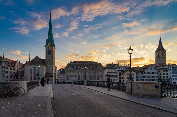 Zurich, Switzerland at Sunset with Churches and Bridge