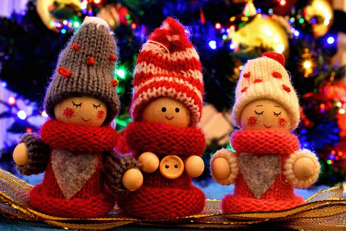 Three Christmas dolls with winter hats and scarves