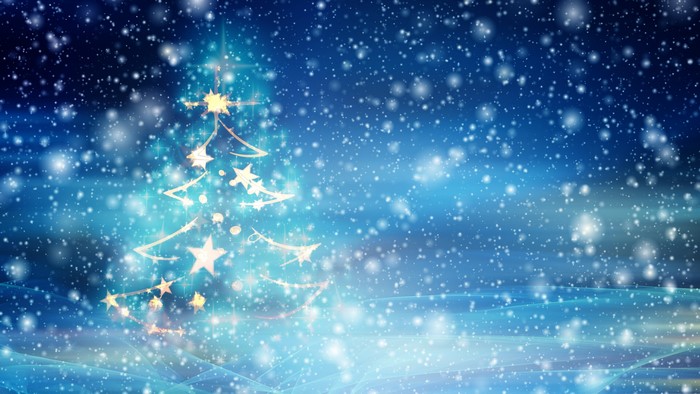 Christmas tree with star decorations in snowfall
