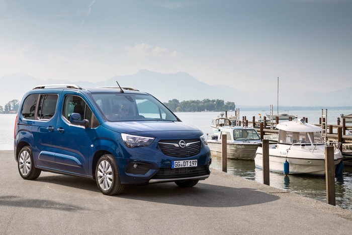 Blue Opel Combo Life Minivan by the Water