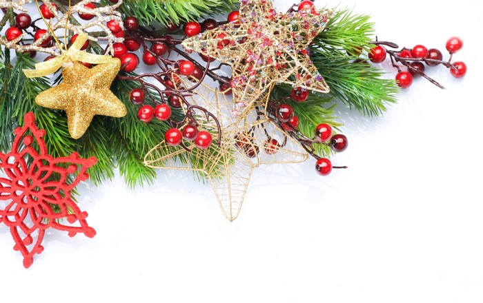 Christmas decoration with pine branches, berries, and stars