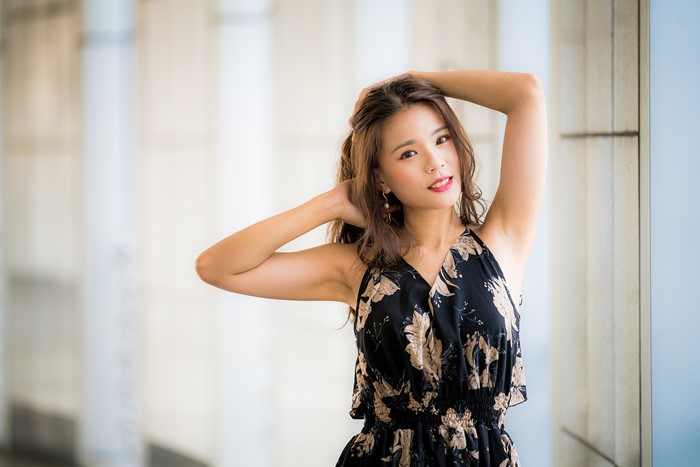 Asian woman with brown hair in a floral dress