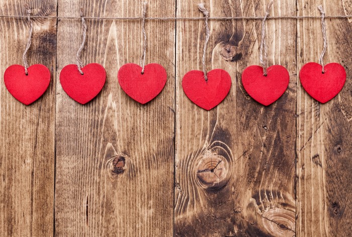 Red Hearts Hanging on Wooden Planks