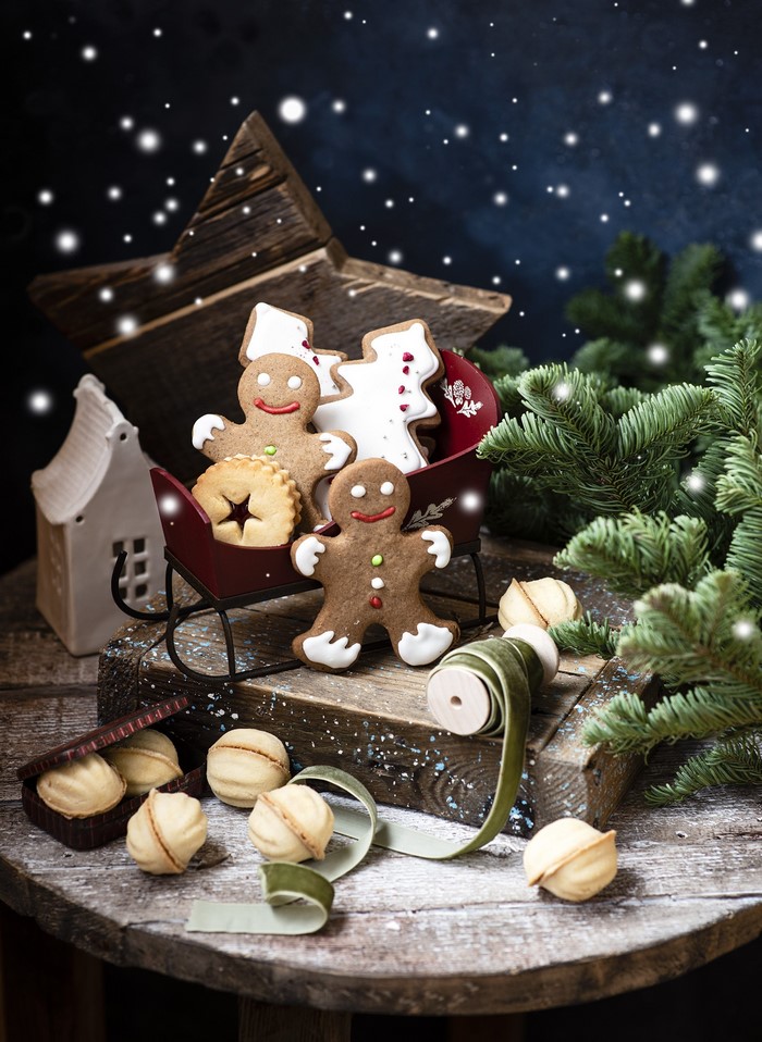 Christmas cookies in a sleigh with pine branches
