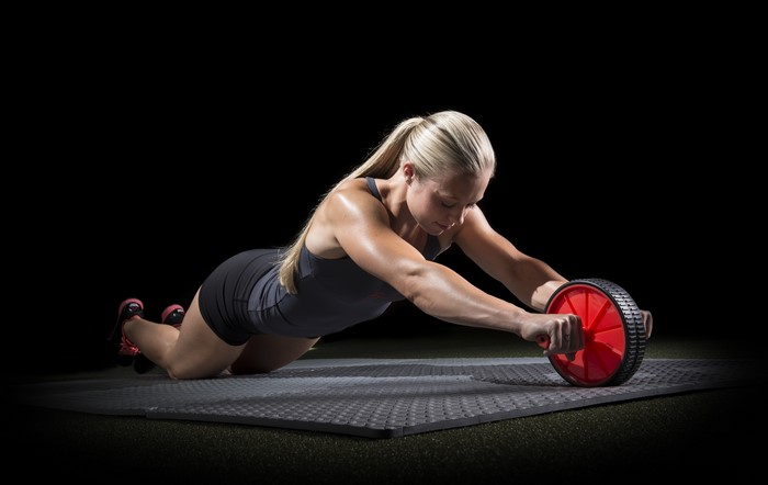 4K Fitness Woman Using Ab Wheel