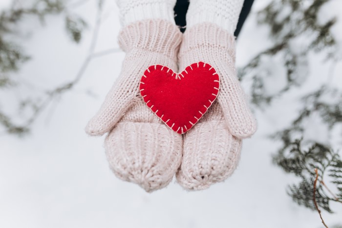 Hands in Mittens Holding a Red Heart
