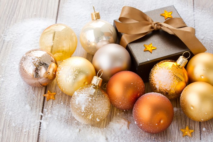 Christmas ornaments and gift box with snow