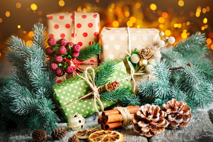 Christmas gifts with pine cones and fir branches