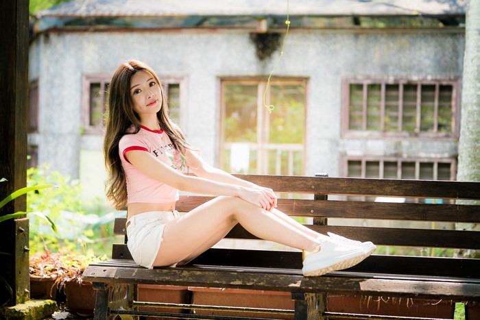 4K Asian Woman Sitting on Bench in Shorts