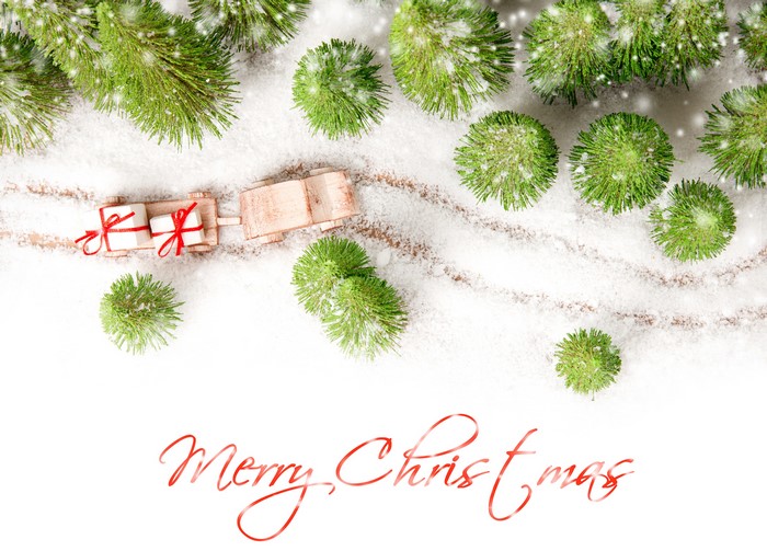 Christmas train with gifts in snow