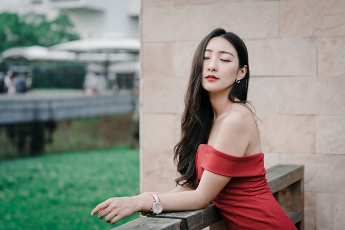 Asian woman in red dress
