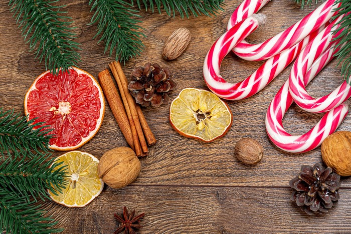 Christmas still life with candy canes, citrus, and spices