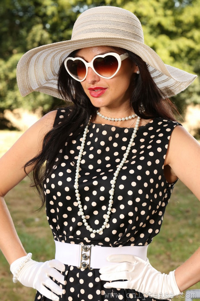 Cassie Clarke wearing a polka dot dress and hat