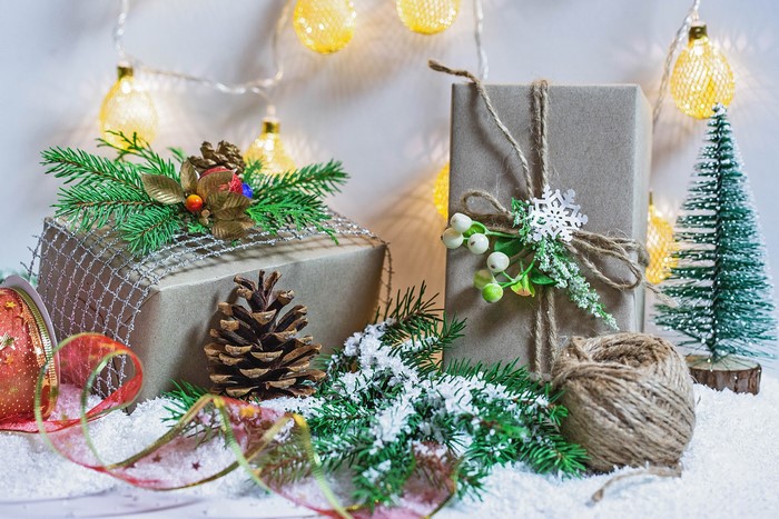 Christmas gifts with pine cones and fairy lights