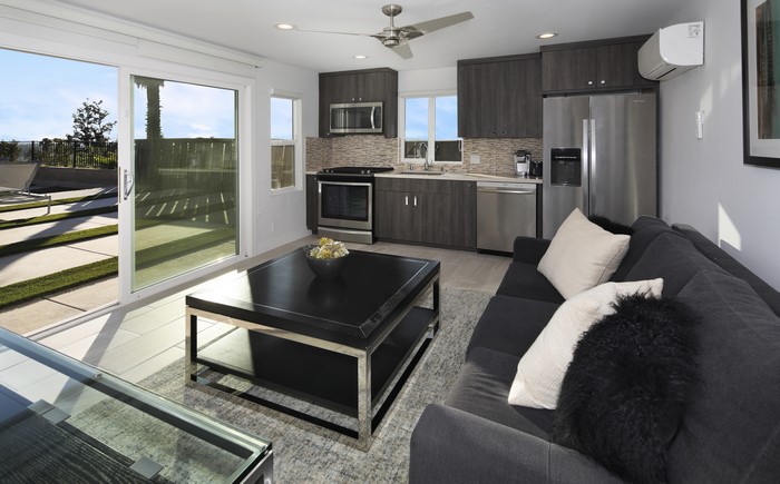 Modern Living Room with Kitchenette and Patio Access