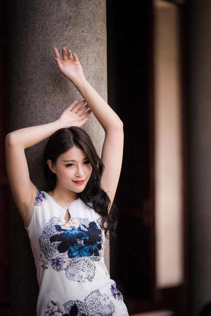 Asian Woman Posing with Hands Raised