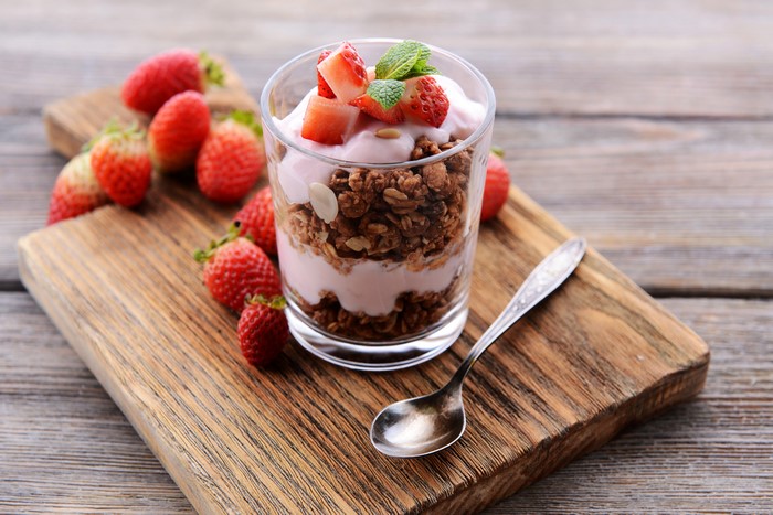 Strawberry Yogurt Parfait with Granola on Cutting Board