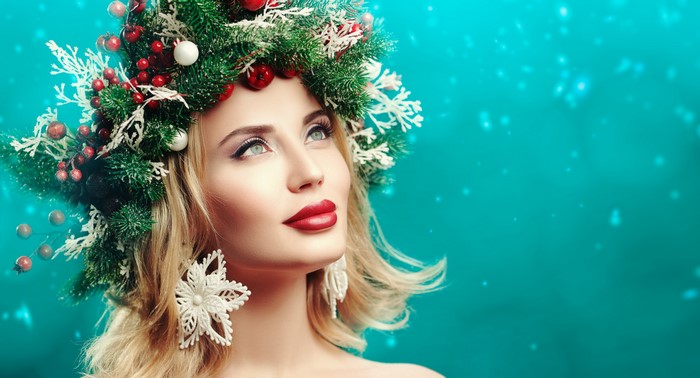 Blonde girl with Christmas wreath and red lips