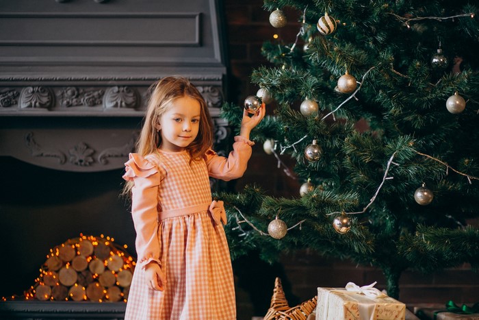Girl decorating a Christmas tree